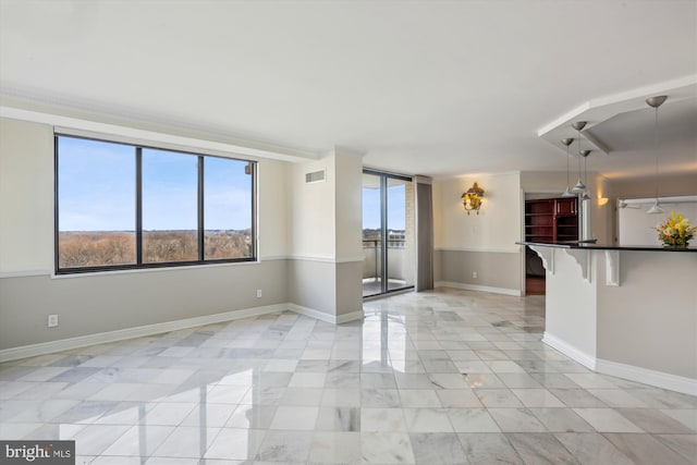 unfurnished room featuring a wealth of natural light