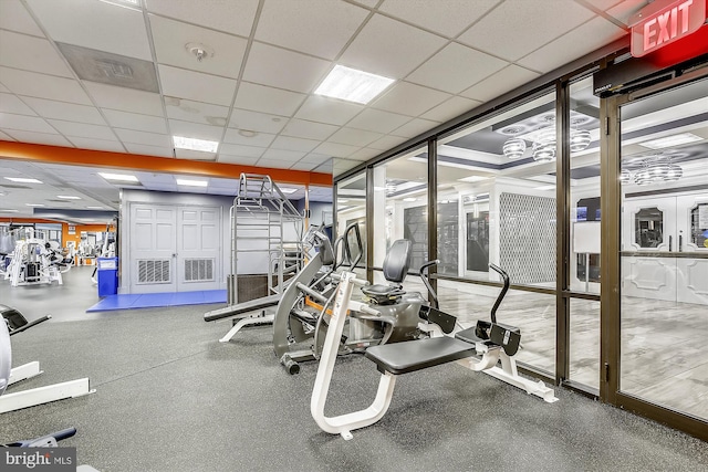 exercise room with a drop ceiling