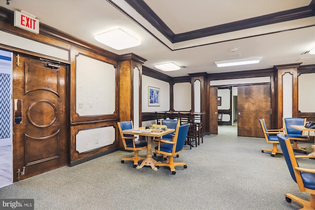 interior space with crown molding and carpet flooring