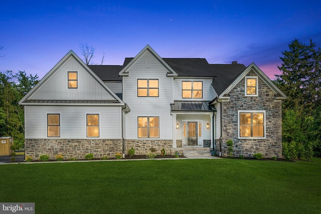 view of front of home with a yard