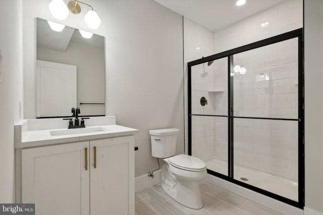 bathroom with vanity, toilet, and walk in shower