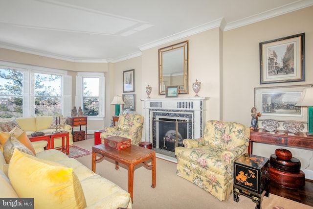 carpeted living room with a premium fireplace and ornamental molding