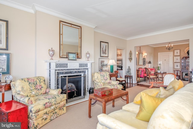 living room with light colored carpet, ornamental molding, a high end fireplace, and a chandelier