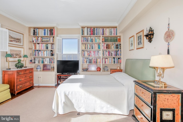 bedroom with crown molding