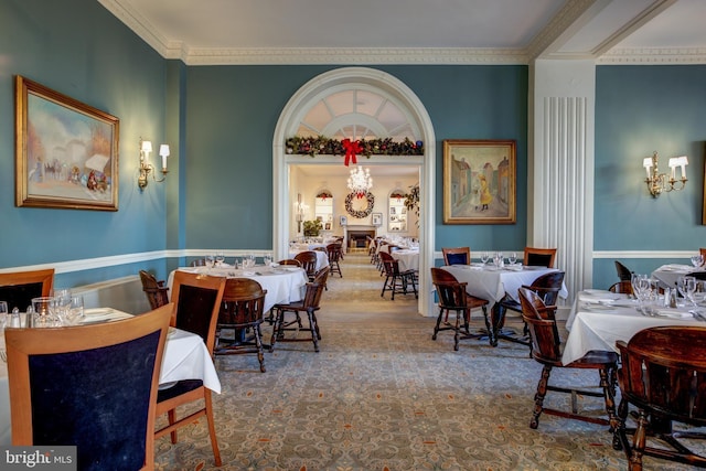 dining space featuring ornamental molding