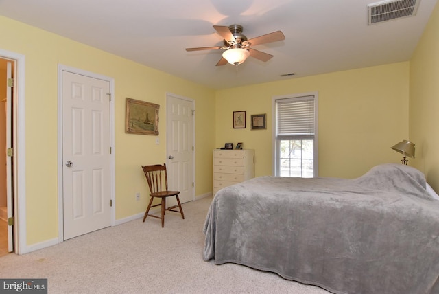 bedroom with light colored carpet and ceiling fan