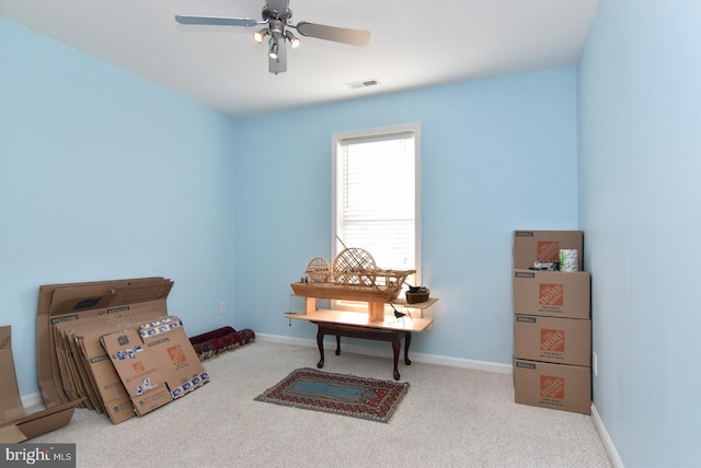 misc room with ceiling fan and light colored carpet