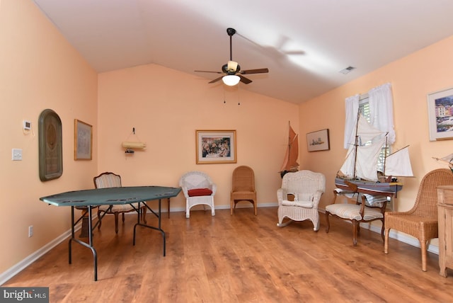 recreation room featuring hardwood / wood-style flooring, ceiling fan, and lofted ceiling