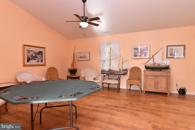 rec room featuring ceiling fan, wood-type flooring, and lofted ceiling