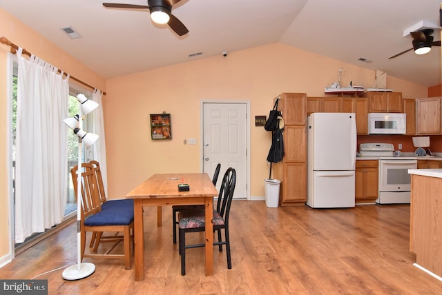 dining area with lofted ceiling, ceiling fan, and light wood-type flooring