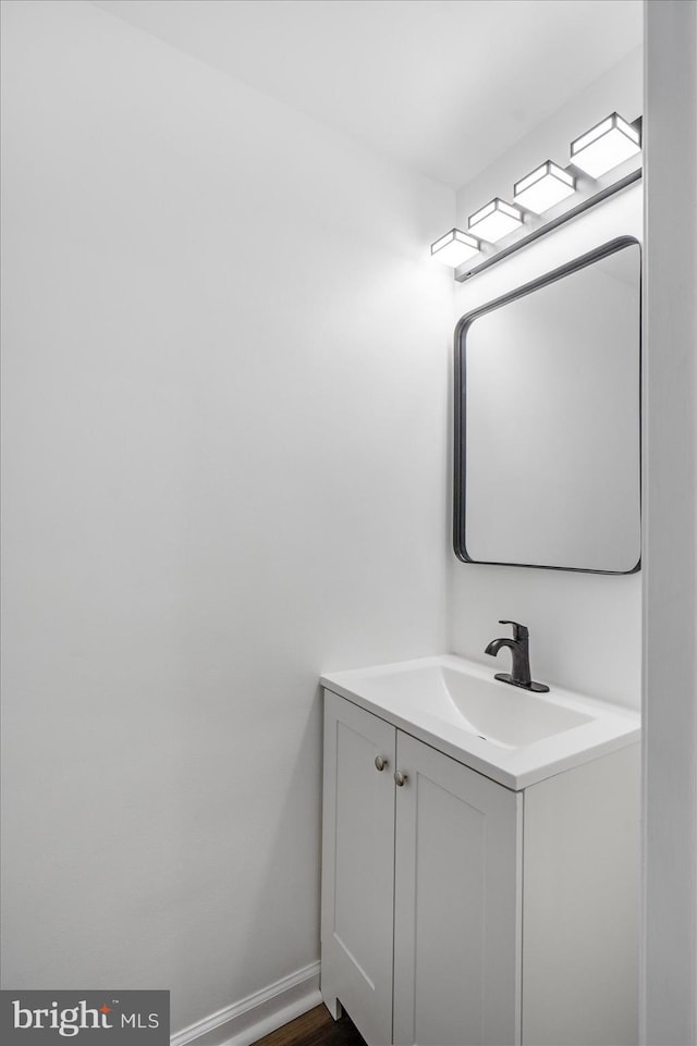 bathroom featuring hardwood / wood-style floors and vanity