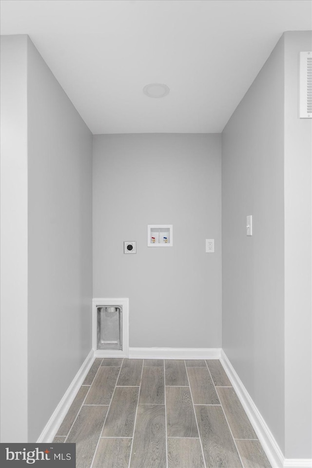 laundry room with hookup for an electric dryer and hookup for a washing machine