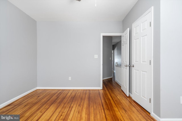 spare room with hardwood / wood-style floors