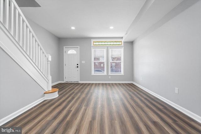 foyer with dark hardwood / wood-style flooring