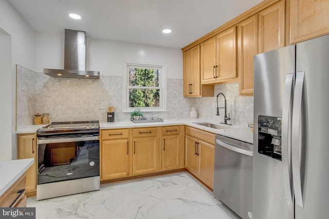 kitchen featuring backsplash, sink, stainless steel appliances, and wall chimney range hood