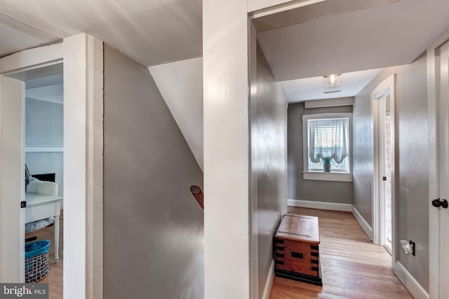 hallway with light wood-type flooring