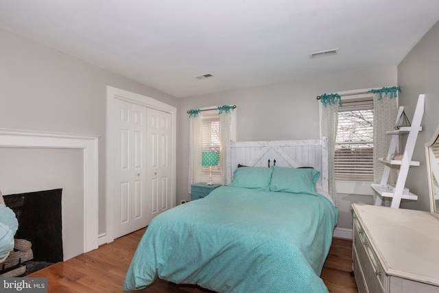 bedroom featuring light hardwood / wood-style flooring and a closet