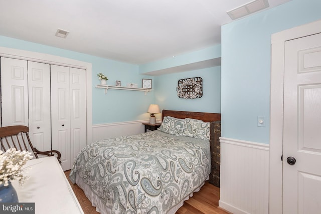 bedroom featuring light hardwood / wood-style flooring and a closet