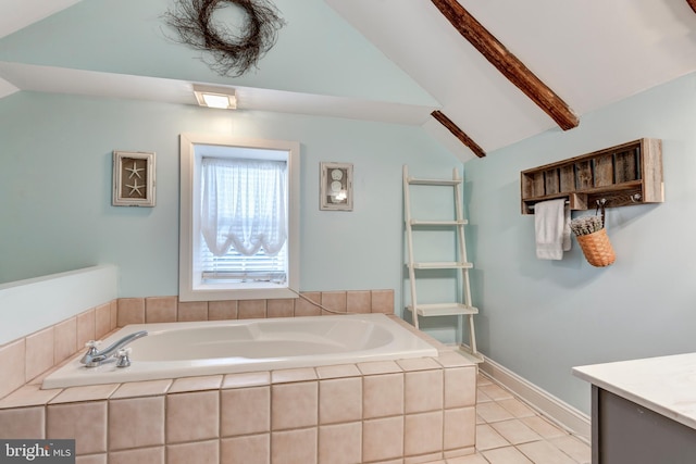 bathroom with vanity, tile patterned floors, lofted ceiling, and tiled tub