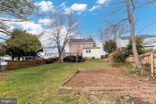 view of yard with a wooden deck