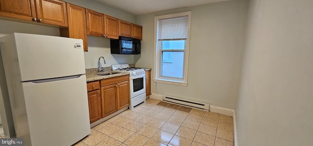 kitchen with white appliances, sink, light tile patterned floors, baseboard heating, and light stone counters