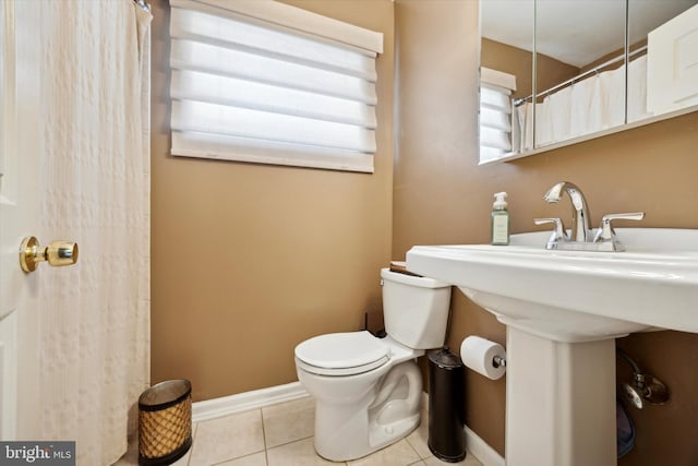 bathroom featuring tile patterned floors and toilet