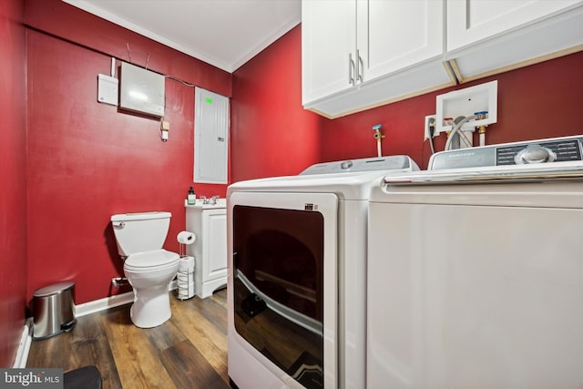 washroom with washing machine and dryer, crown molding, dark hardwood / wood-style flooring, and electric panel