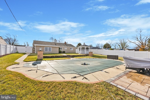 view of swimming pool featuring a patio area and a lawn