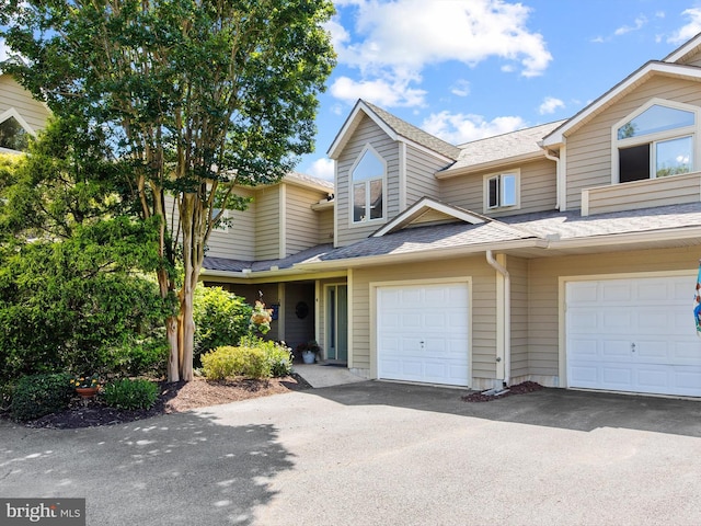 townhome / multi-family property featuring a garage