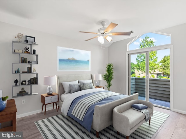 bedroom with hardwood / wood-style floors, ceiling fan, lofted ceiling, and access to outside