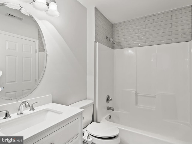 full bathroom featuring vanity, shower / bath combination, and toilet