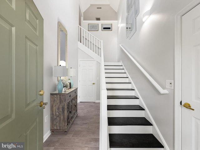 stairway featuring hardwood / wood-style floors