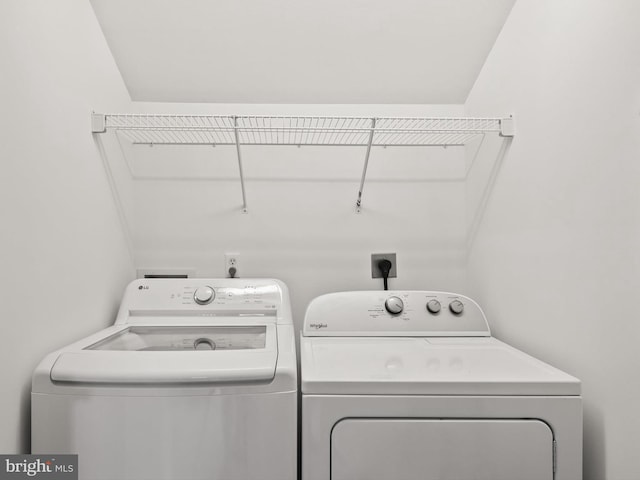 clothes washing area featuring washing machine and dryer