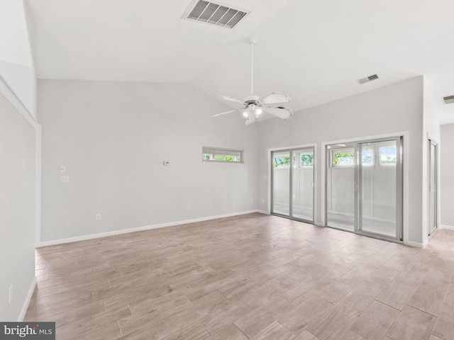 unfurnished room with ceiling fan and lofted ceiling