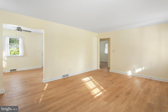 unfurnished room with ceiling fan and light hardwood / wood-style flooring