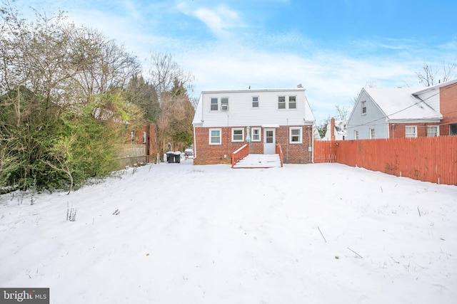 view of snow covered house