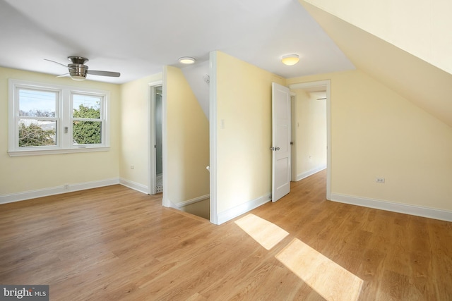 bonus room with light hardwood / wood-style floors, ceiling fan, and lofted ceiling