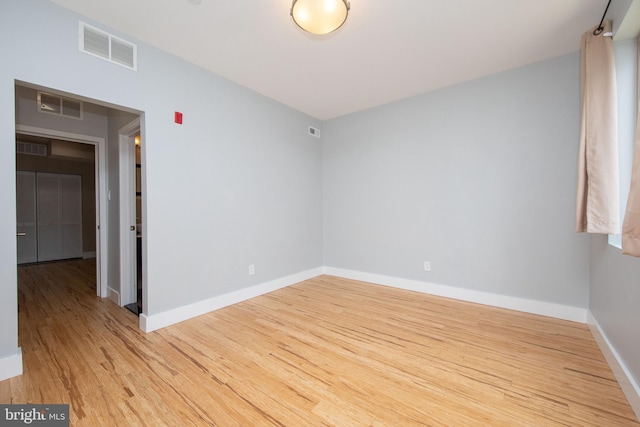 unfurnished room featuring light hardwood / wood-style flooring