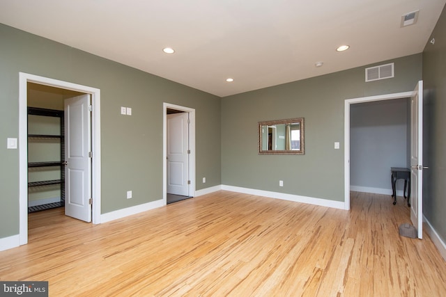 unfurnished bedroom with light hardwood / wood-style flooring