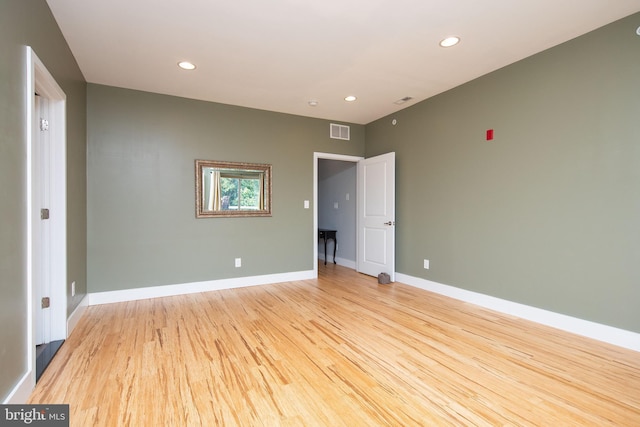 unfurnished bedroom with light wood-type flooring