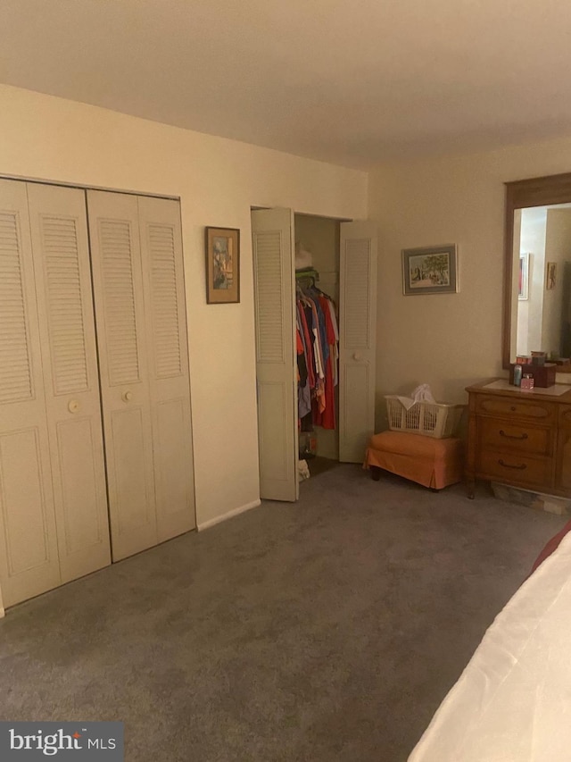 bedroom with dark colored carpet