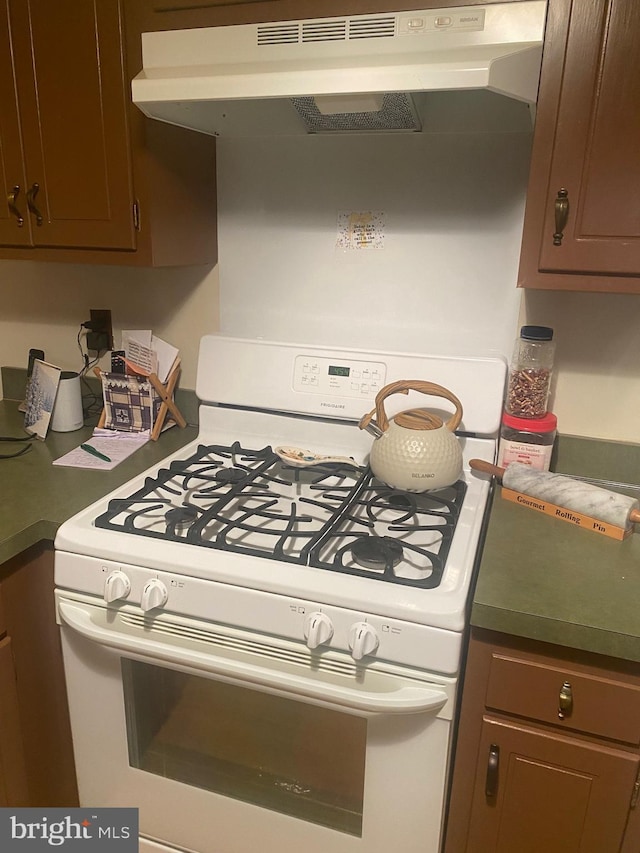 kitchen featuring white range with gas cooktop