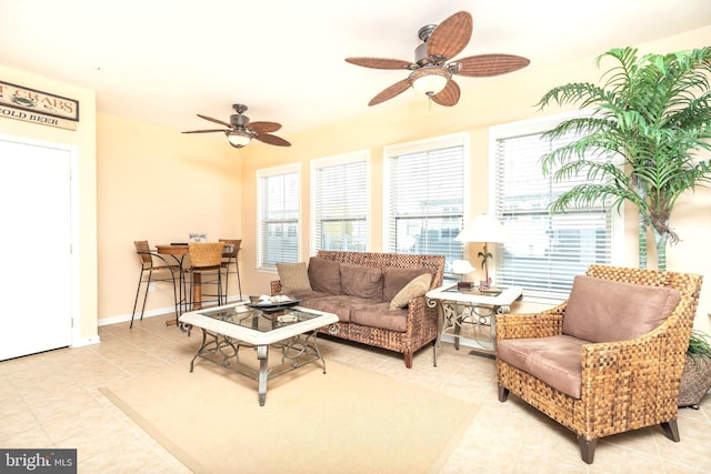 living room featuring light tile patterned floors and ceiling fan