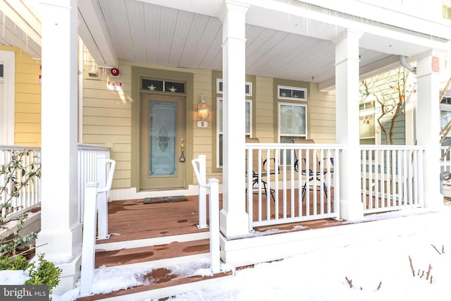 doorway to property with covered porch