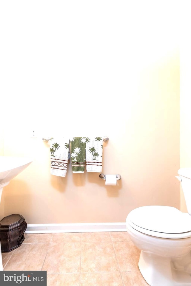 bathroom featuring toilet and tile patterned floors