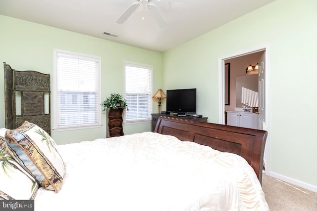 bedroom featuring carpet, connected bathroom, and ceiling fan