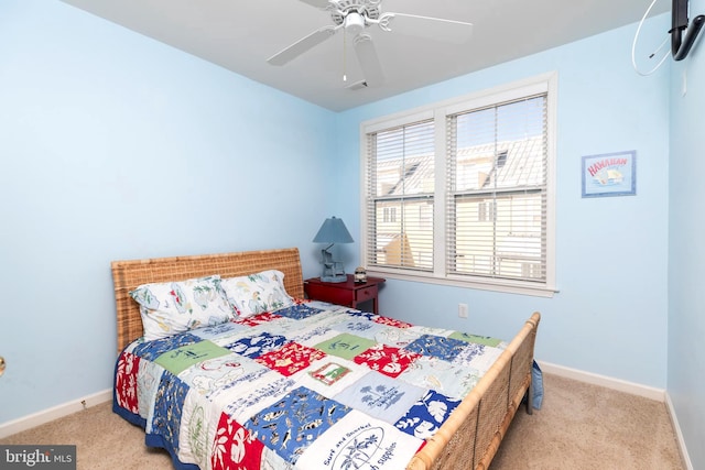 bedroom with ceiling fan and light carpet