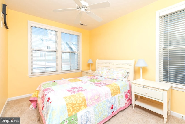 bedroom featuring ceiling fan and light colored carpet