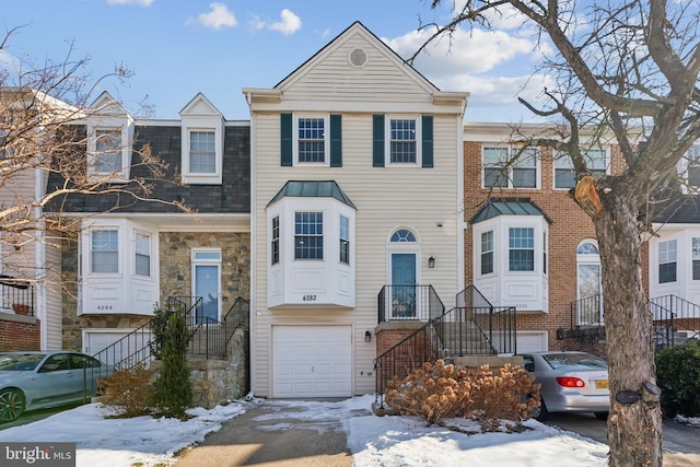 townhome / multi-family property featuring a garage