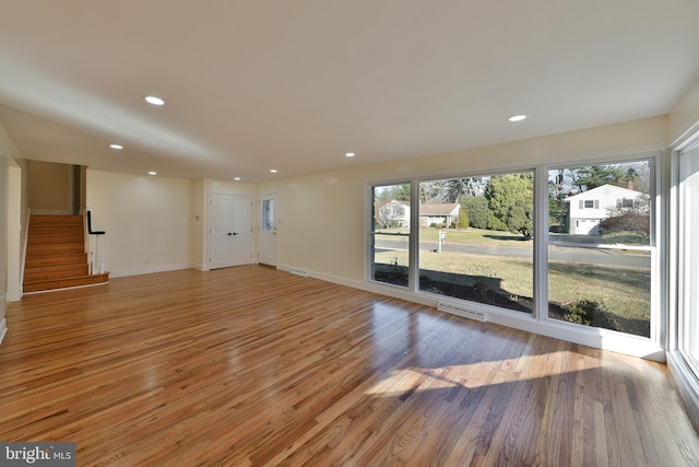 unfurnished living room with light hardwood / wood-style floors